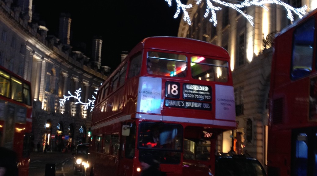 See the christmas lights on a heritage red London bus